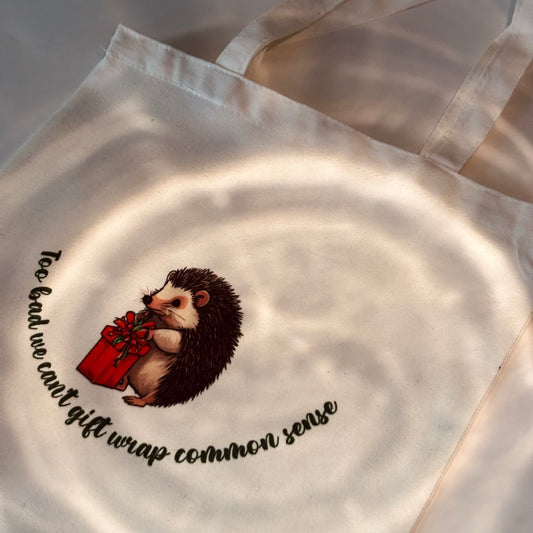 “Too Bad We Can’t Gift Wrap Common Sense” Tote Bag